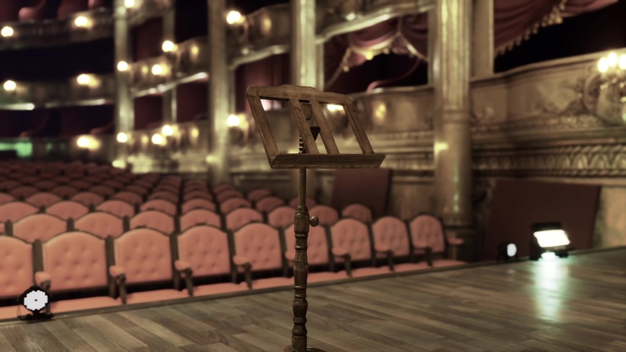 Palco riccamente decorato con posti a sedere e illuminazione soffusa prima dello spettacolo