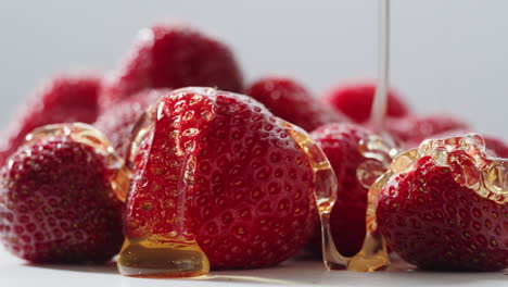 honey drizzled strawberries
