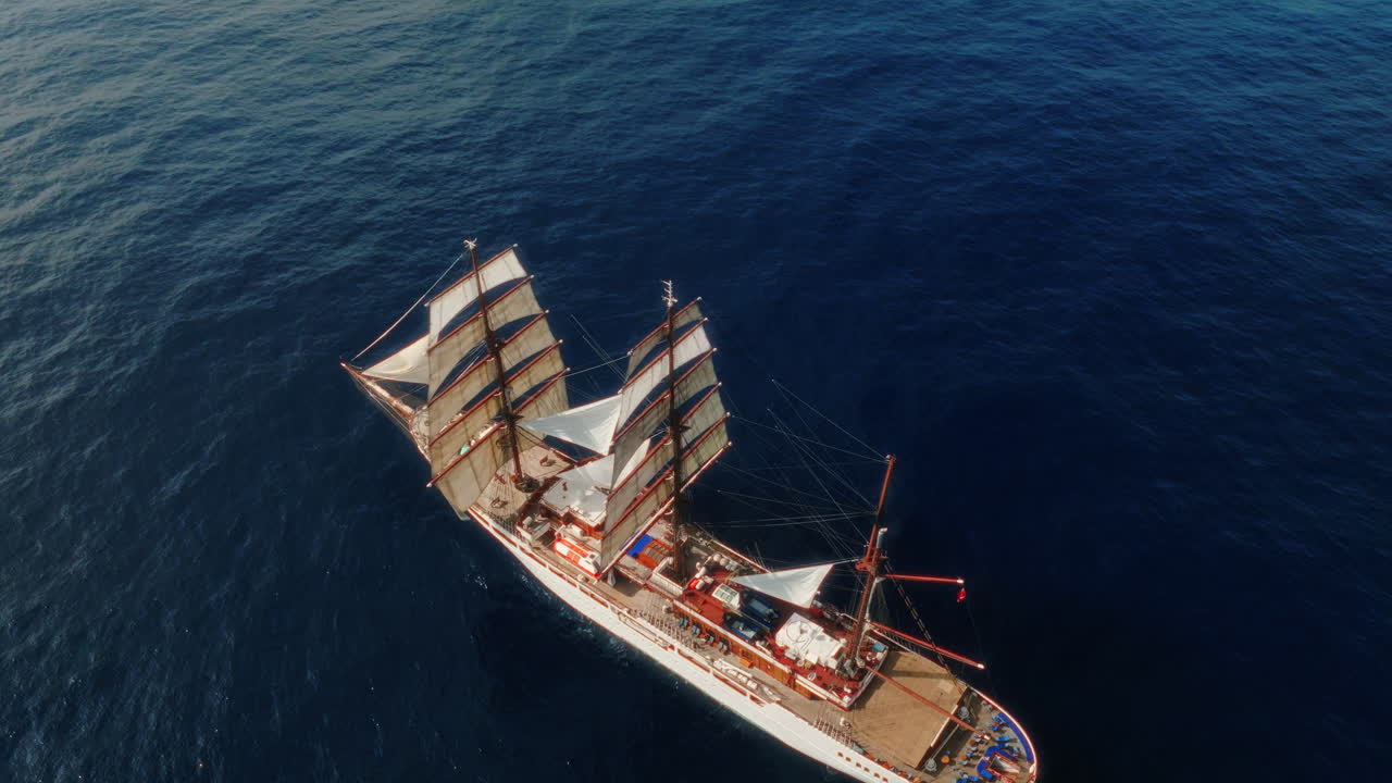 Sea Cloud luxury cruise ship sailing vessel in the Atlantic Ocean in bad weather, Drone revealing shot