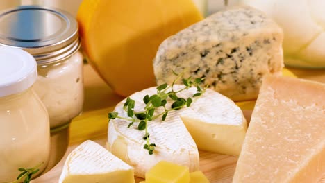 assorted cheeses and dairy items on a table