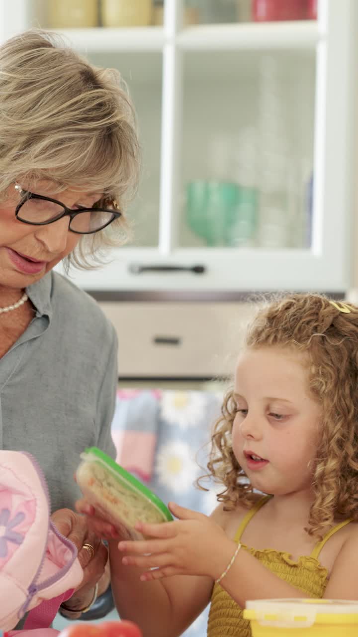Grandmother and Granddaughter Packing Lunch