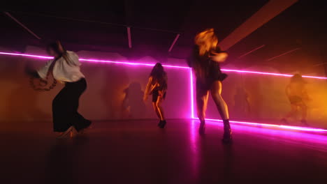 energetic dance performance under neon lights
