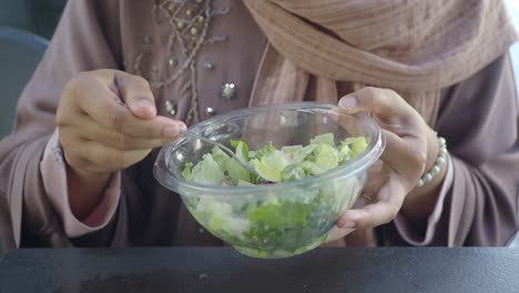 woman enjoying a healthy salad meal