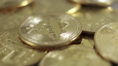 btc bitcoin golden coins rotating, crypto money close up studio shot investment concept