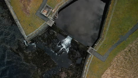 Reservoir-inlet-slow-motion-top-down-view-at-Haweswater-English-Lake-District-UK